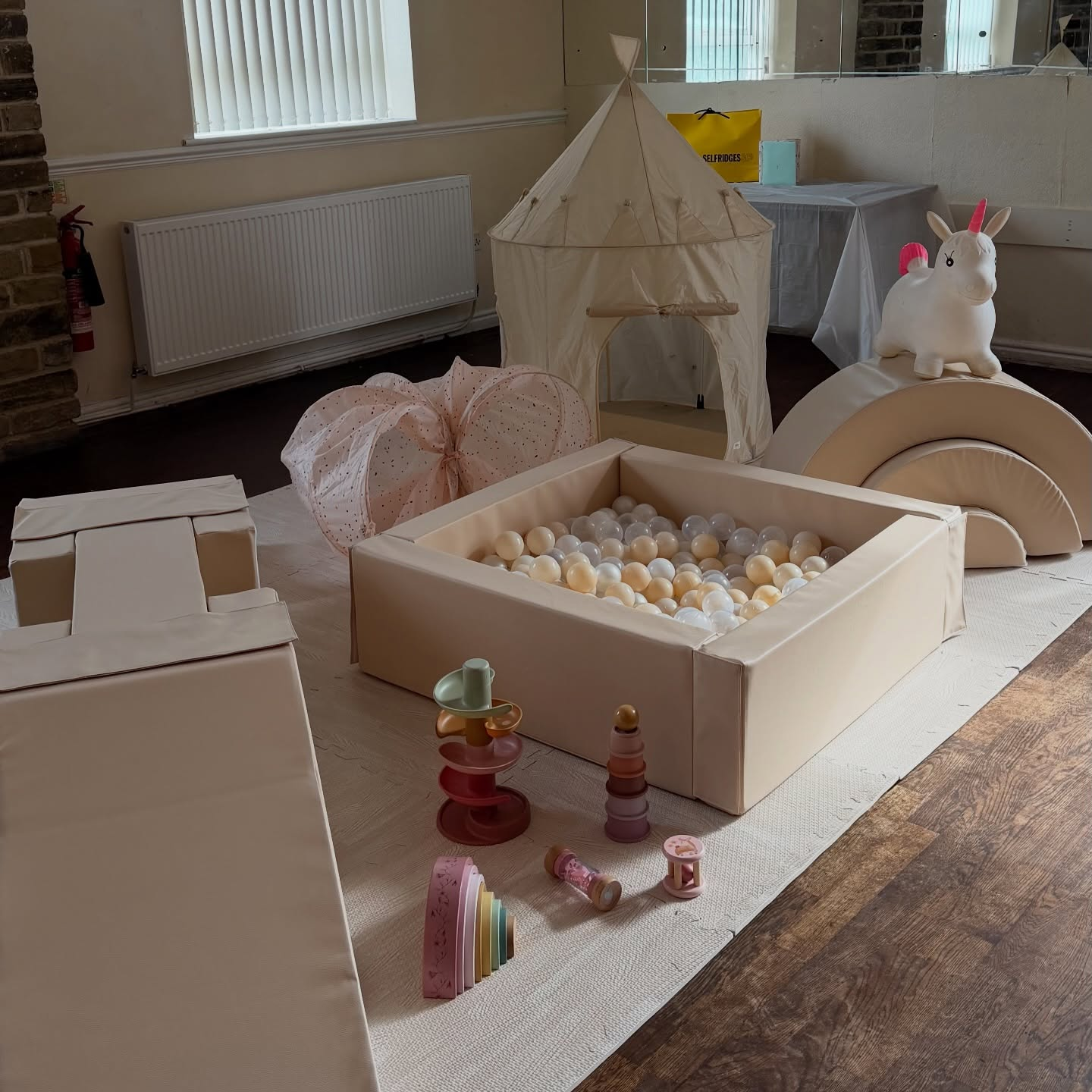 Neutral cream soft play with ball pit, castle tent and unicorn hopper